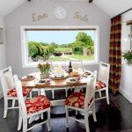 Dining room overlooking garden and meadow beyond at our luxury cottage Cornwall